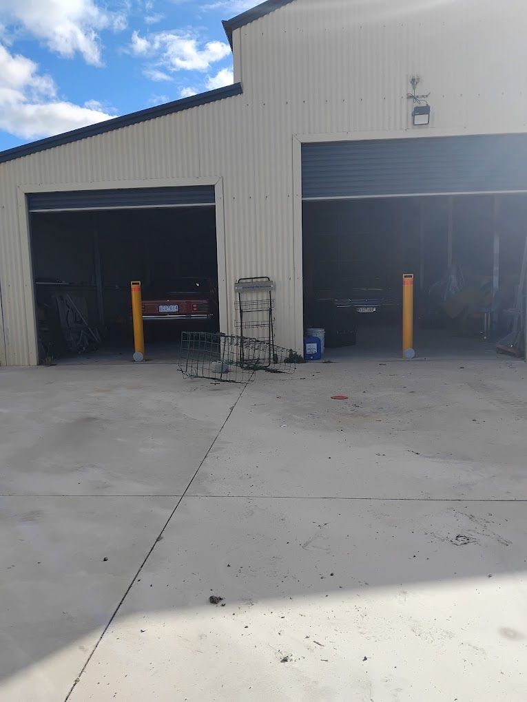 2 Bollards side by side, protecting 2 classic cars 