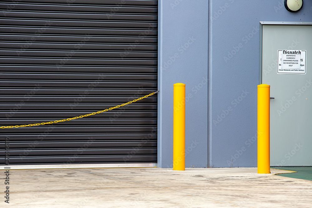 2 bollards at the front of a factory