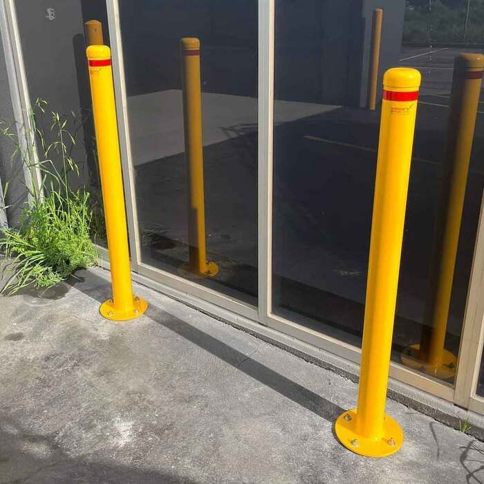 2 bollards safeguarding a infrastructure to prevent ram raids