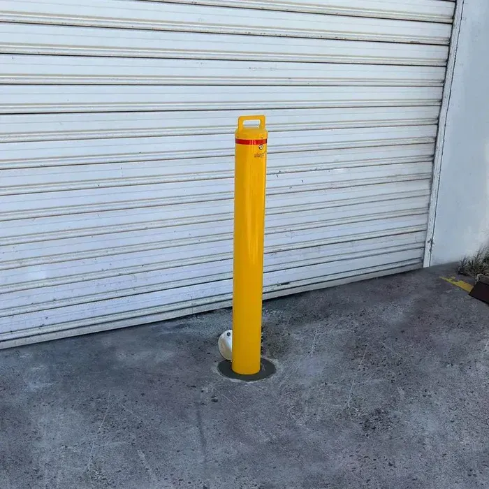 bollard installed to protect garage from ram raids