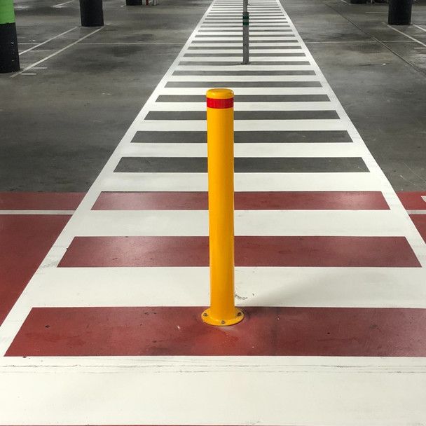 yellow bollard installed in walkway