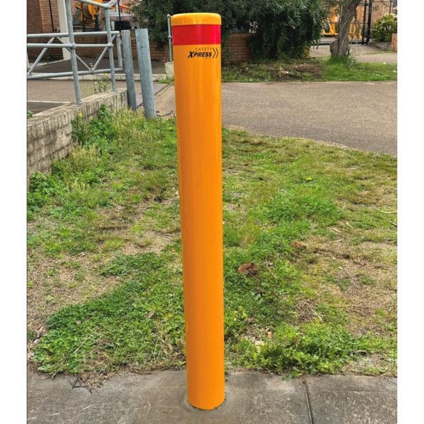 gas bollard installed next to a grass patch on the footpath
