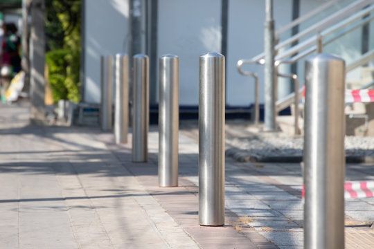chrome bollard installed to protect a building