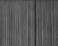 A close up of a gray curtain with a grainy texture.