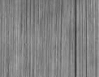 A close up of a gray wood grain texture.