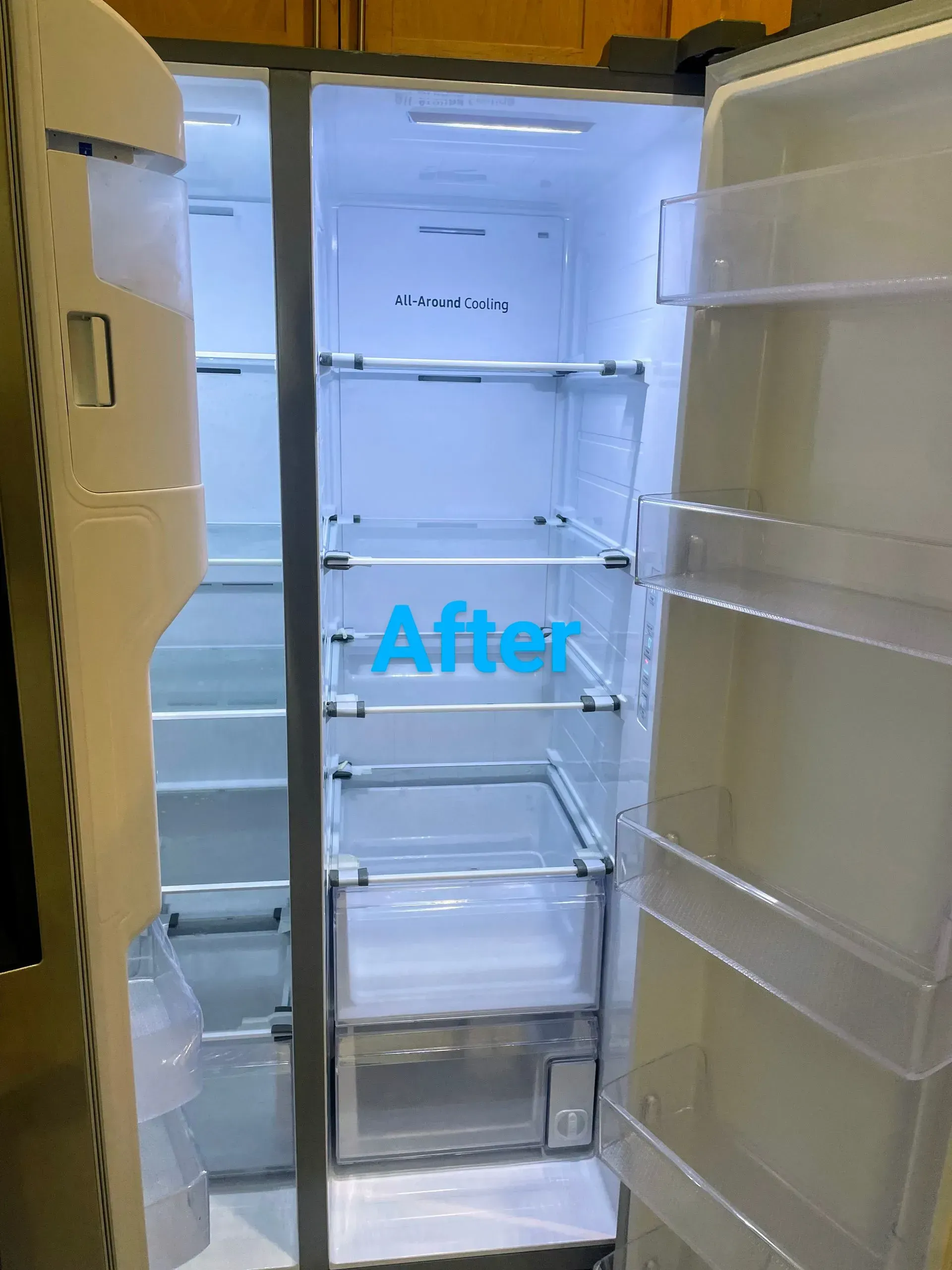 Empty refrigerator interior, bright white light. 