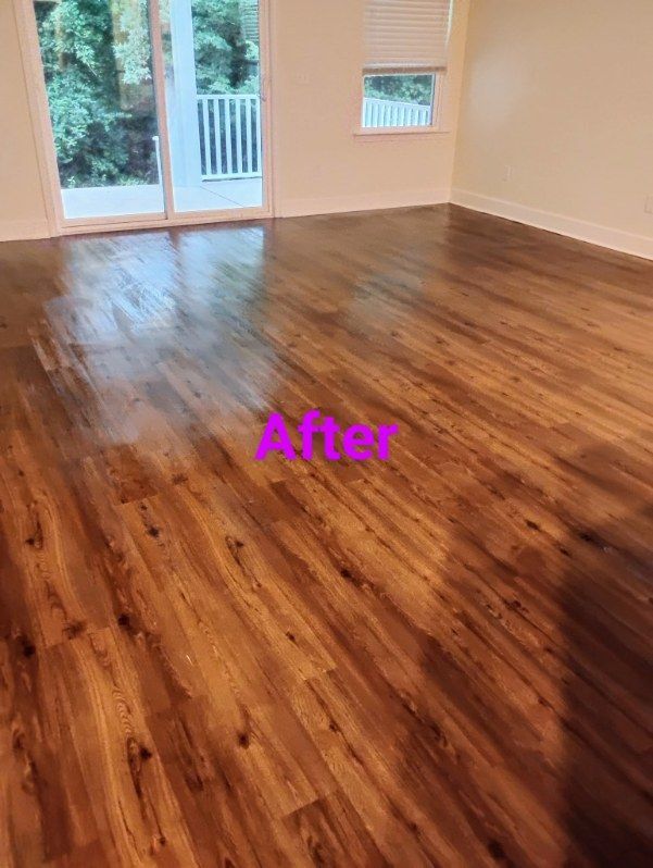 Newly finished brown hardwood floor in a room with a balcony and window, labeled 