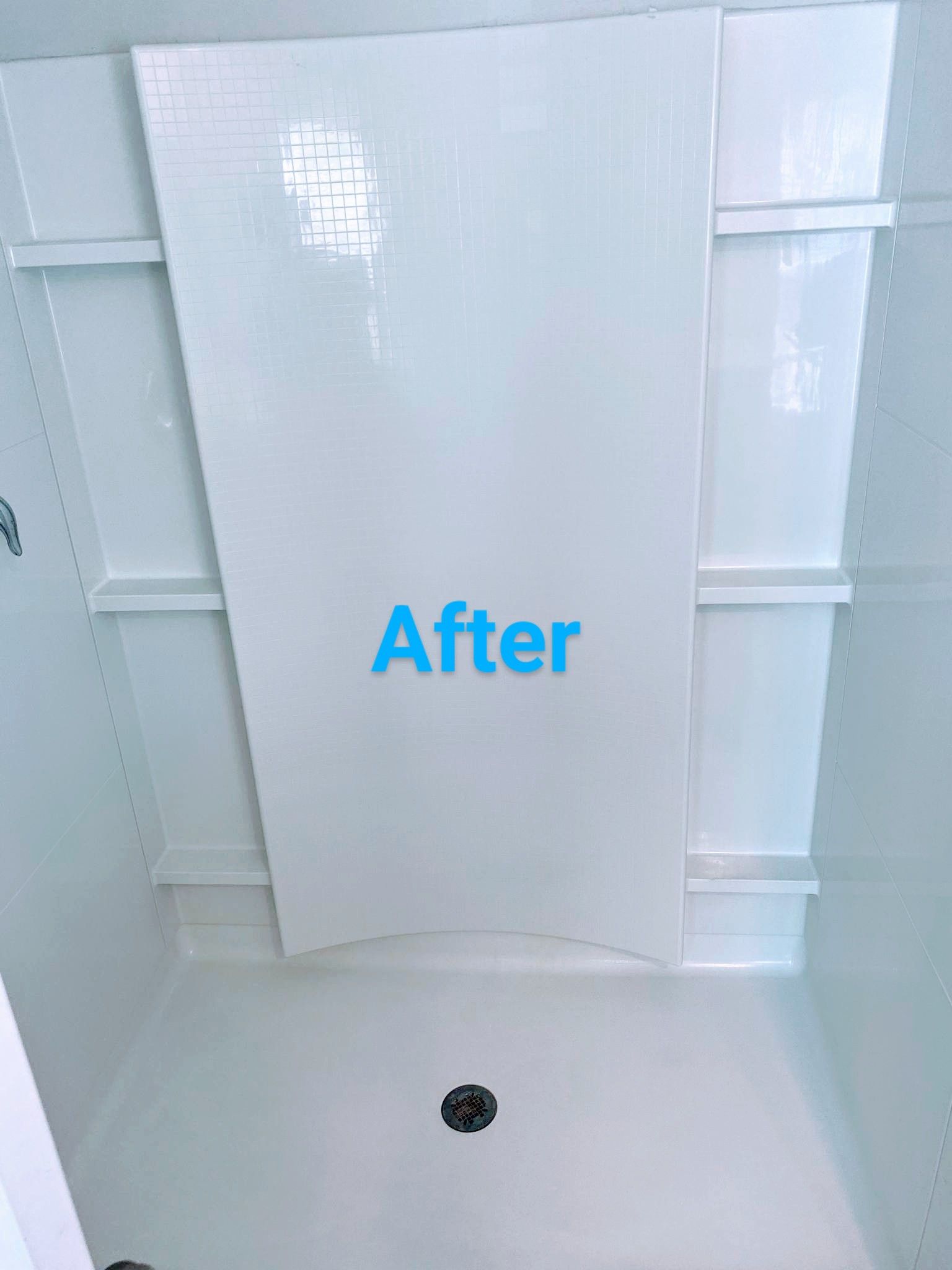 White shower with installed wall panels.