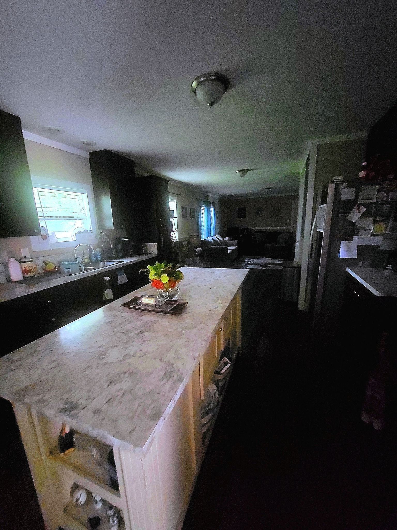 A kitchen with a large island in the middle of the room.