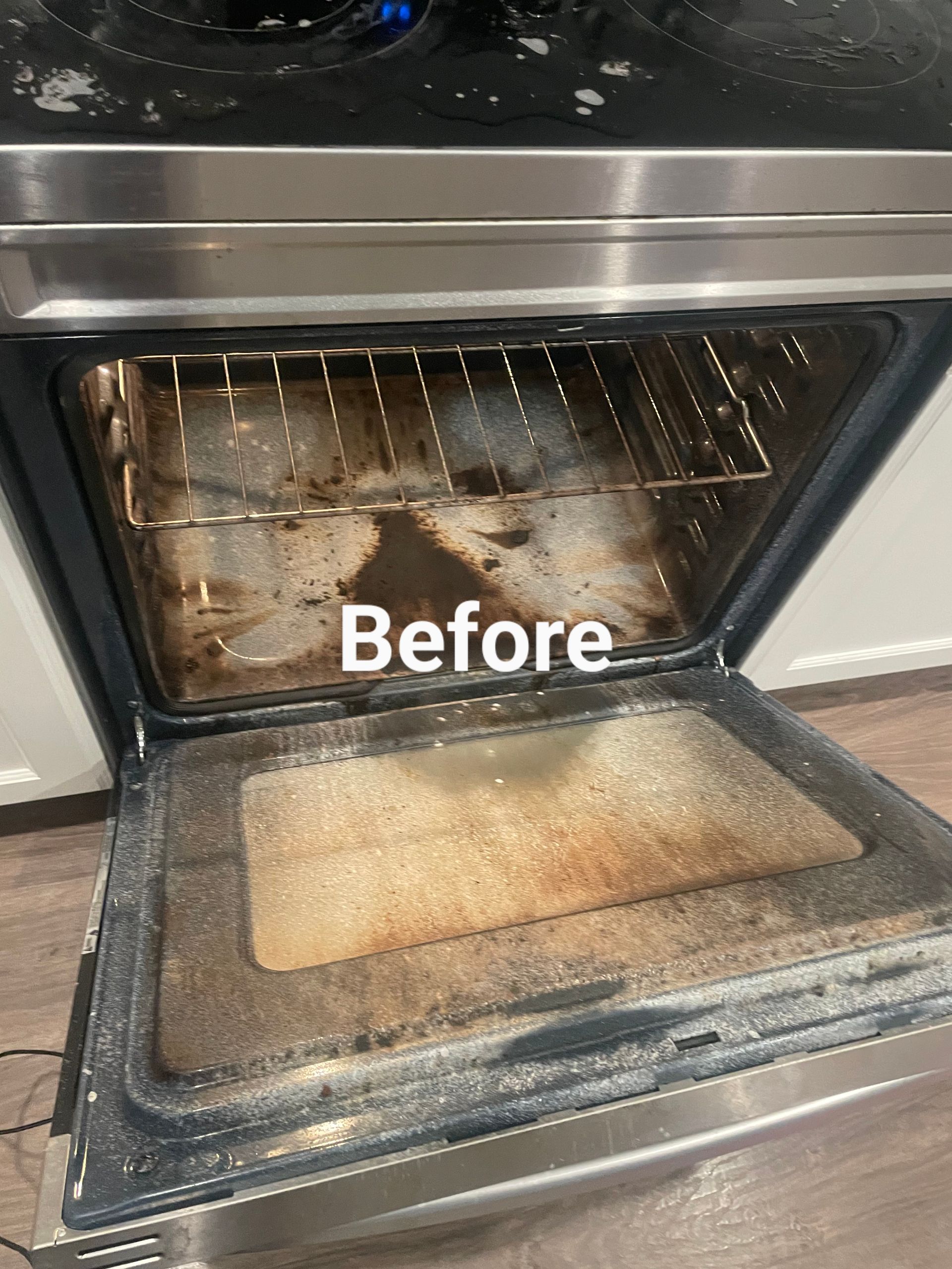 Dirty oven interior before cleaning. Brown food residue on racks, bottom, and walls. Stainless steel exterior.