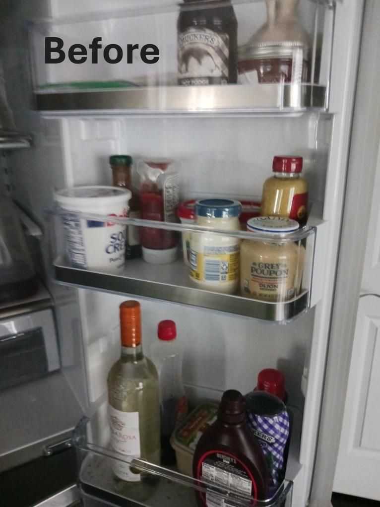 A refrigerator filled with bottles , jars , condiments and yogurt.
