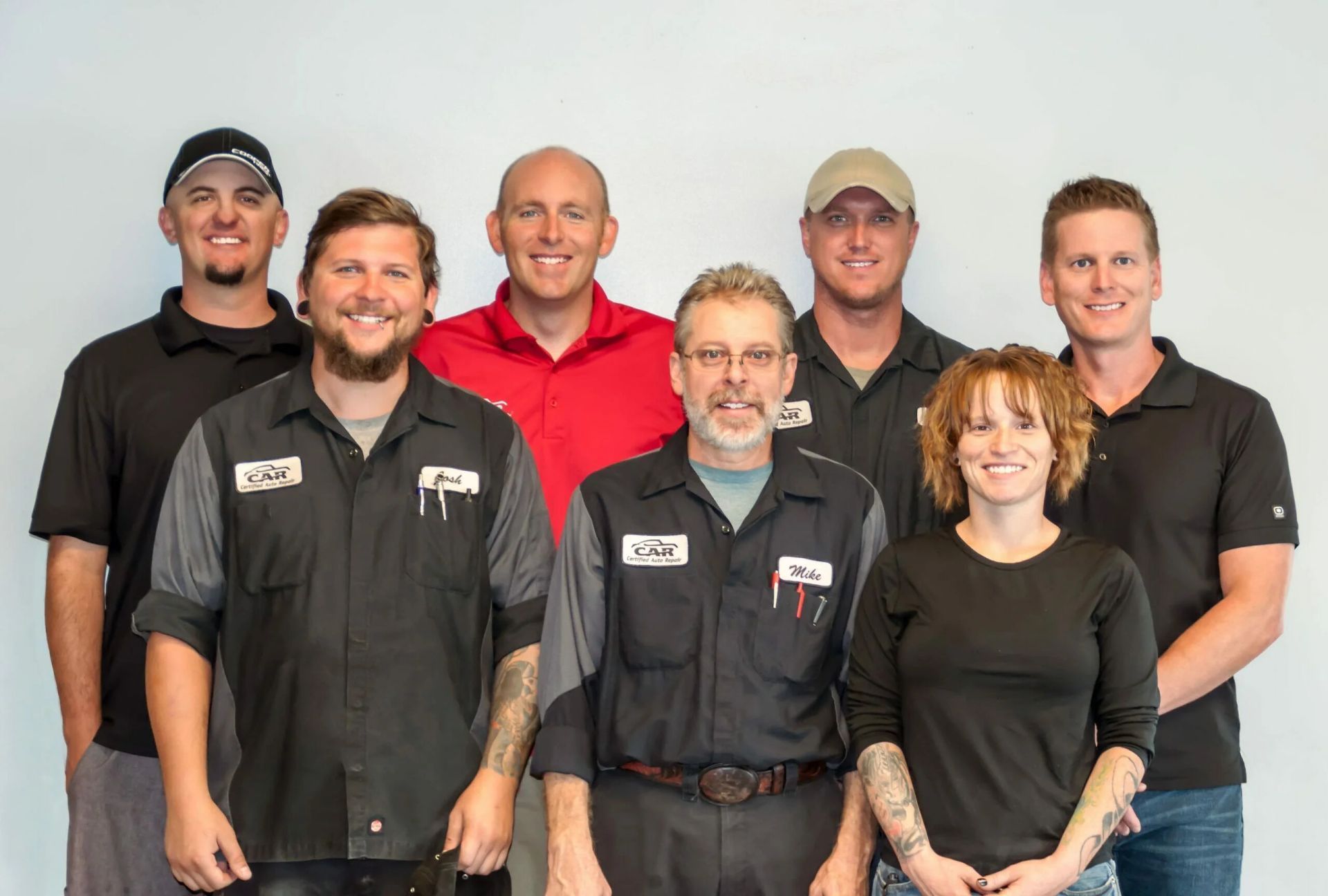 A group of people are posing for a picture together. | Certified Auto Repair
