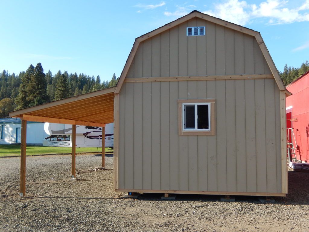 A barn with a pergola on top of it