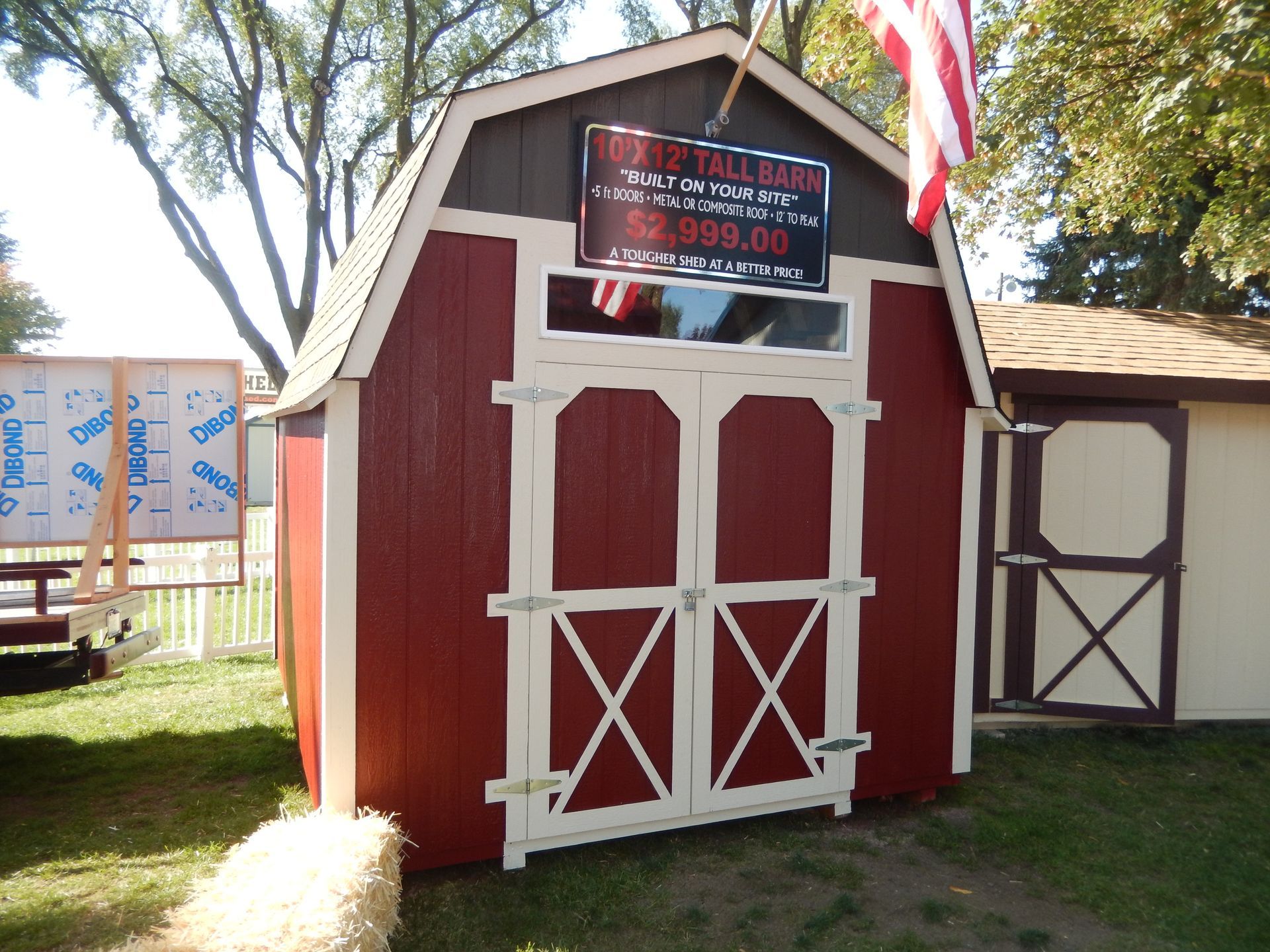 A red barn with a sign on it that says ' red tail room '