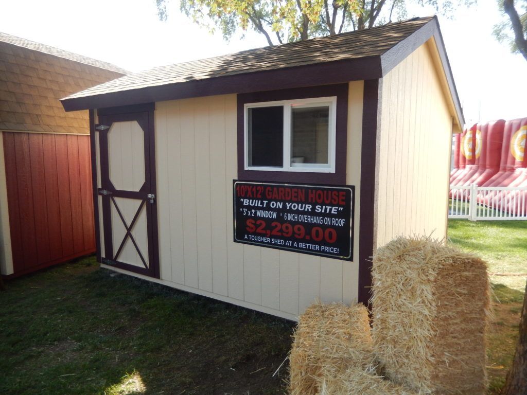 A small shed with a sign on it that says $ 2,299.00