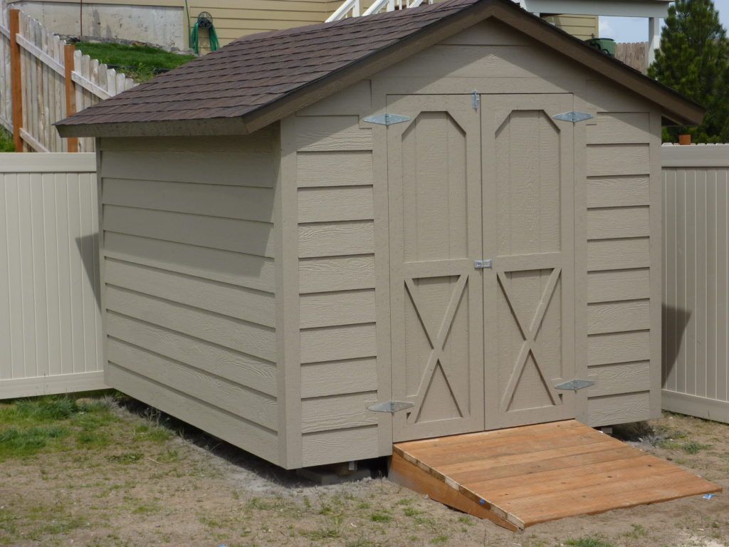 A small shed with a ramp in front of it