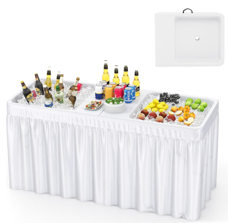 White ice table with food and drinks in ice, white skirting, and an inset of a sink.