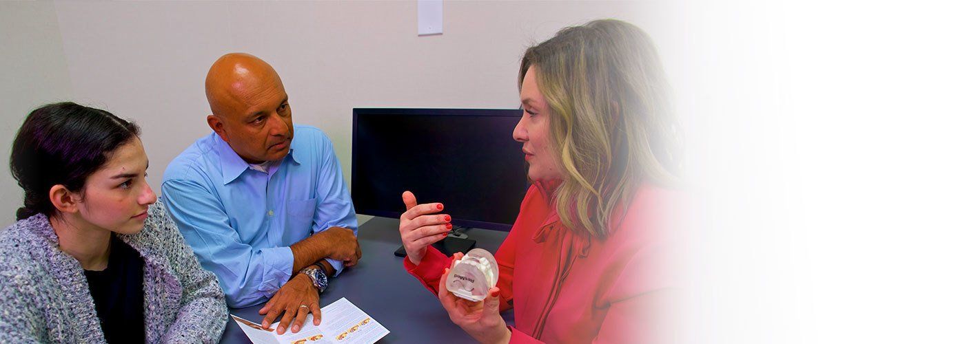 Couple consulting a dentist