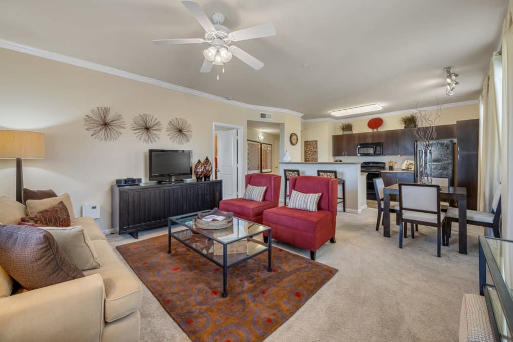 Apartment living room filled with furniture and a ceiling fan at Marquis Sonoran Preserve in Norterra Phoenix, AZ.