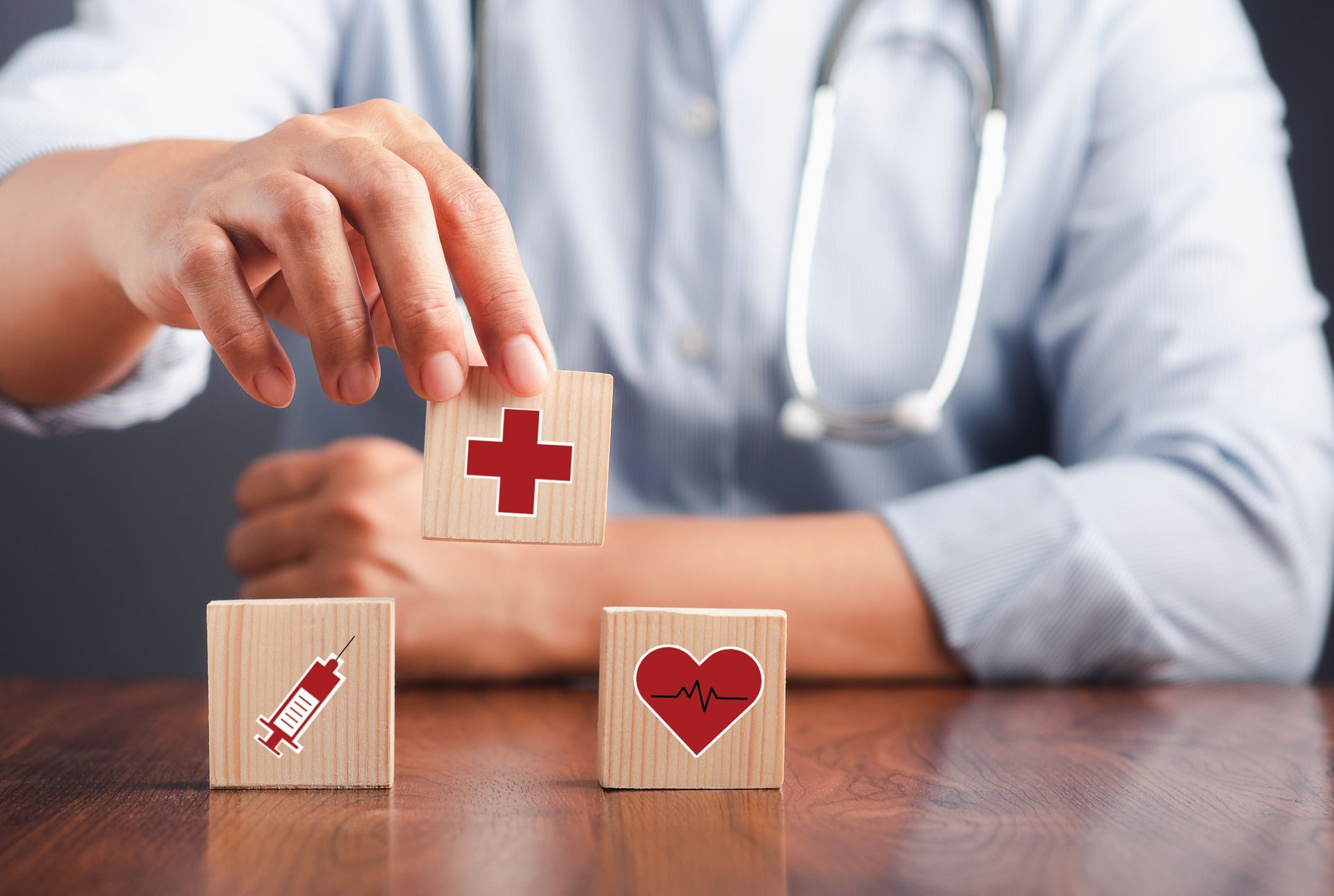 Doctor Holding A Wooden Block With Healthcare Icon