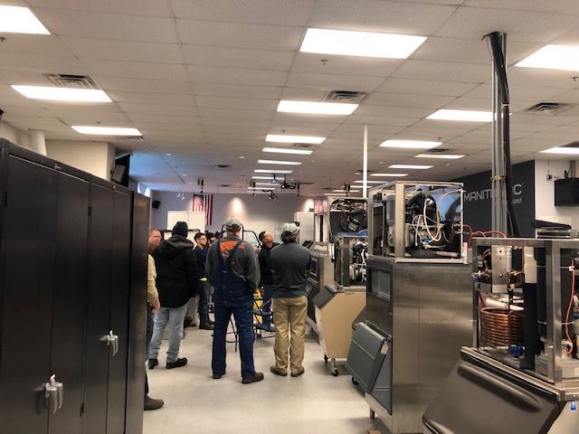 A kitchen with stainless steel appliances and a stove.
