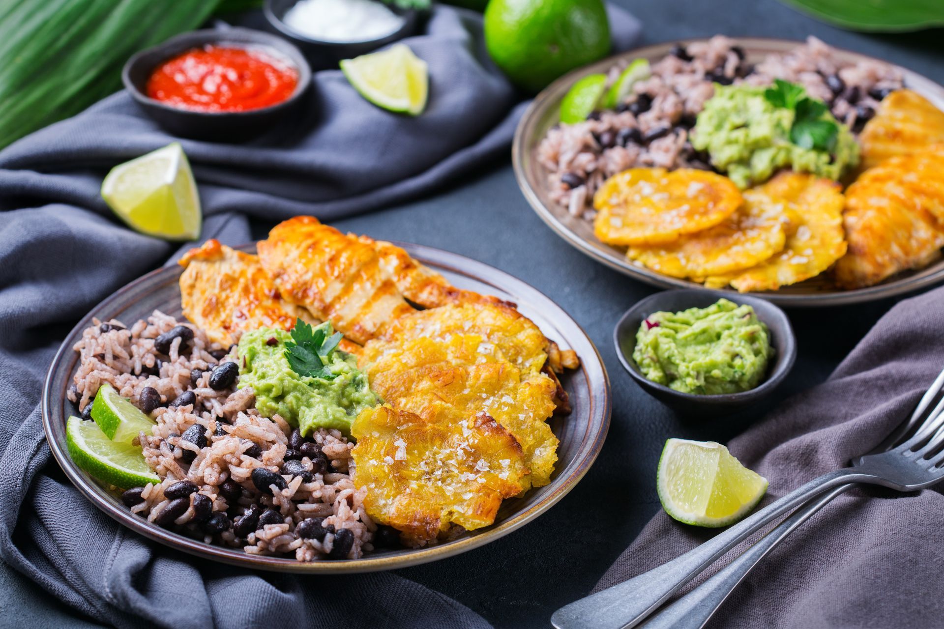 A close up of two plates of food on a table.