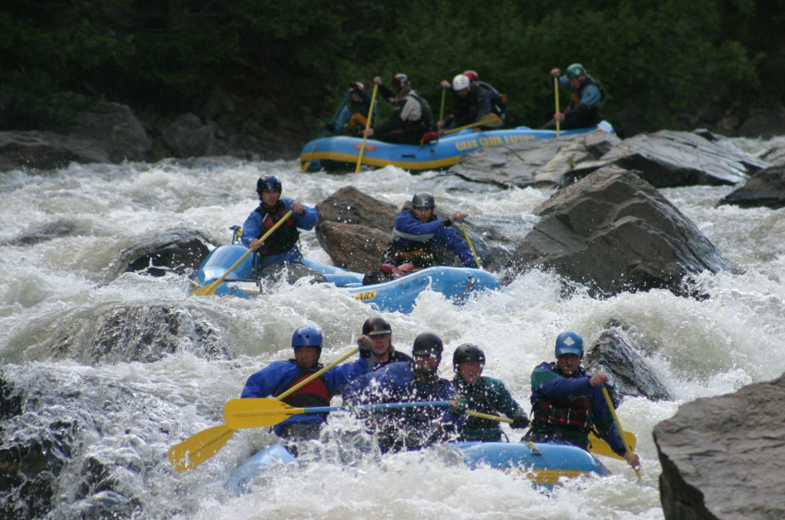 A group of people are rafting down a river.