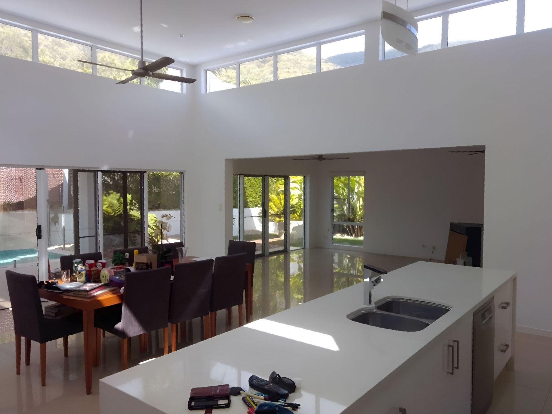 A White House With A Blue Garage Door And A Balcony — Kiwi Painter In Mooroobool, QLD