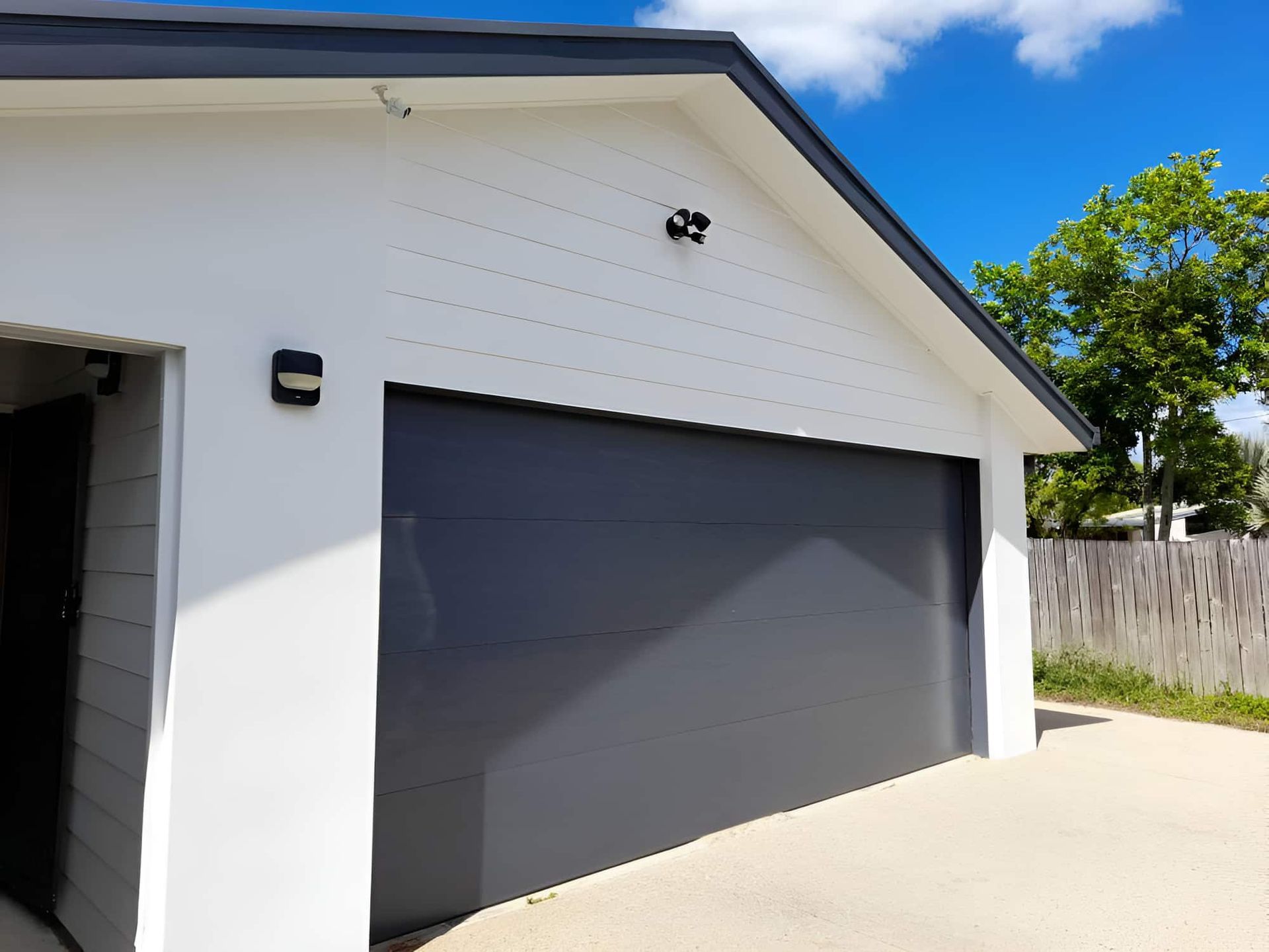 A White House With A Gray Garage Door — Kiwi Painter In Mooroobool, QLD