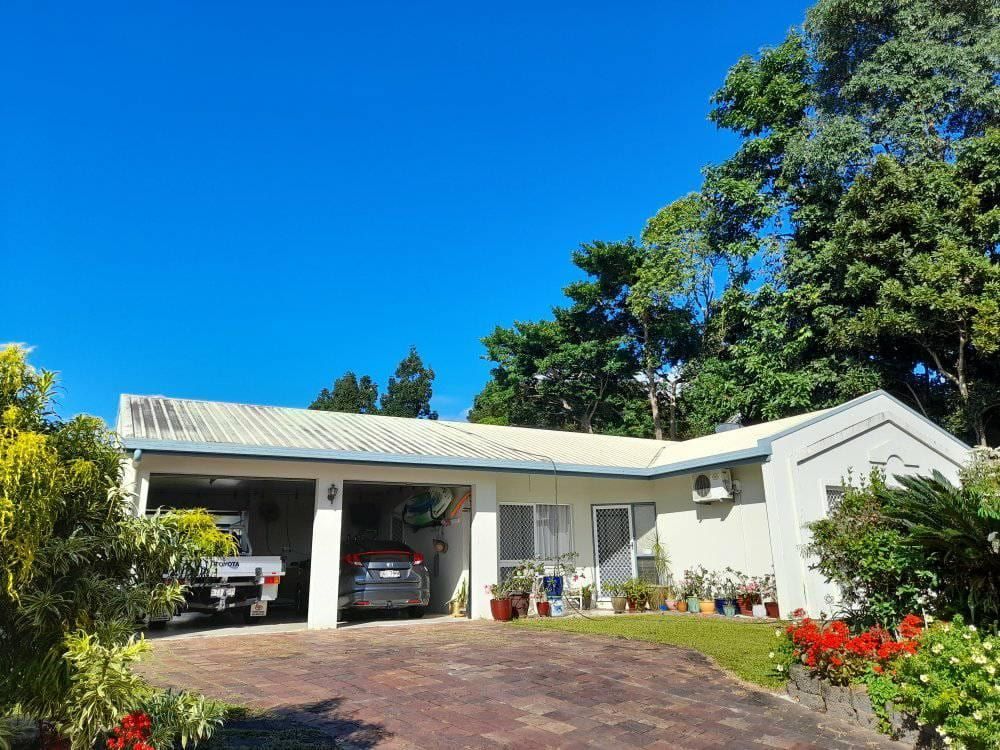 A White House With A Car Parked In The Driveway — Kiwi Painter In Cairns, QLD