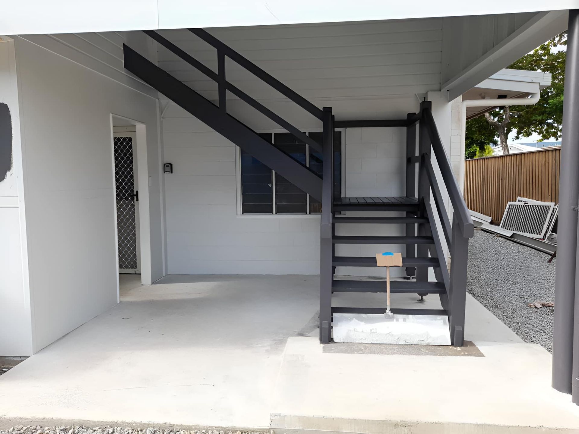 A Set Of Stairs Leading Up To The Second Floor Of A House — Kiwi Painter In Port Douglas, QLD