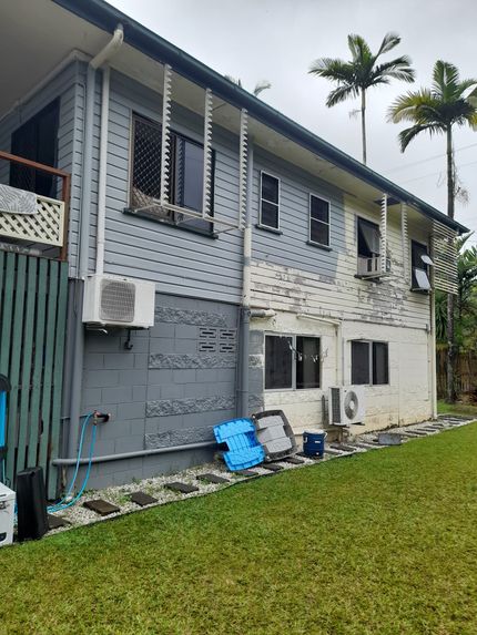 A Before And After Photo Of A House With A Garage — Kiwi Painter In Mooroobool, QLD