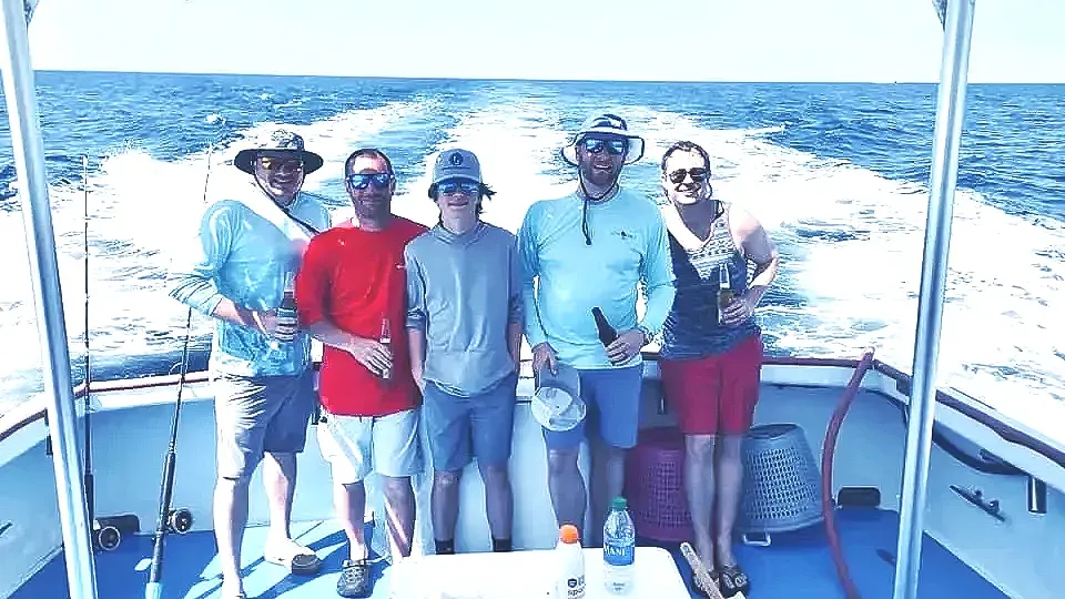 Group of friends on deep sea fishing charter Panama City Beach with Reel Groovy