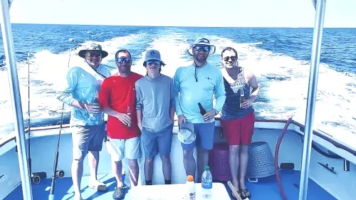 Group of friends on deep sea fishing charter Panama City Beach with Reel Groovy