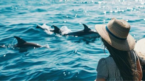 Couple on dolphin cruise Panama City Beach with Reel Groovy charter boat