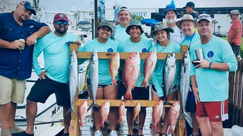 Group with rack of fish after fishing charter Panama City Beach with Reel Groovy