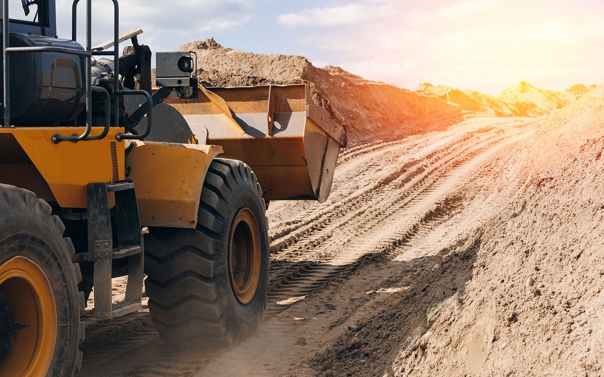 A bulldozer is moving dirt on a construction site.