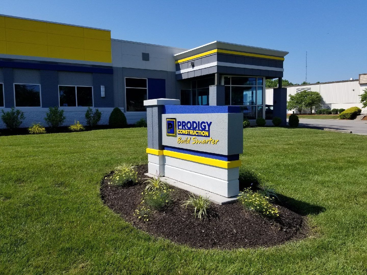 A large building with a sign in front of it.