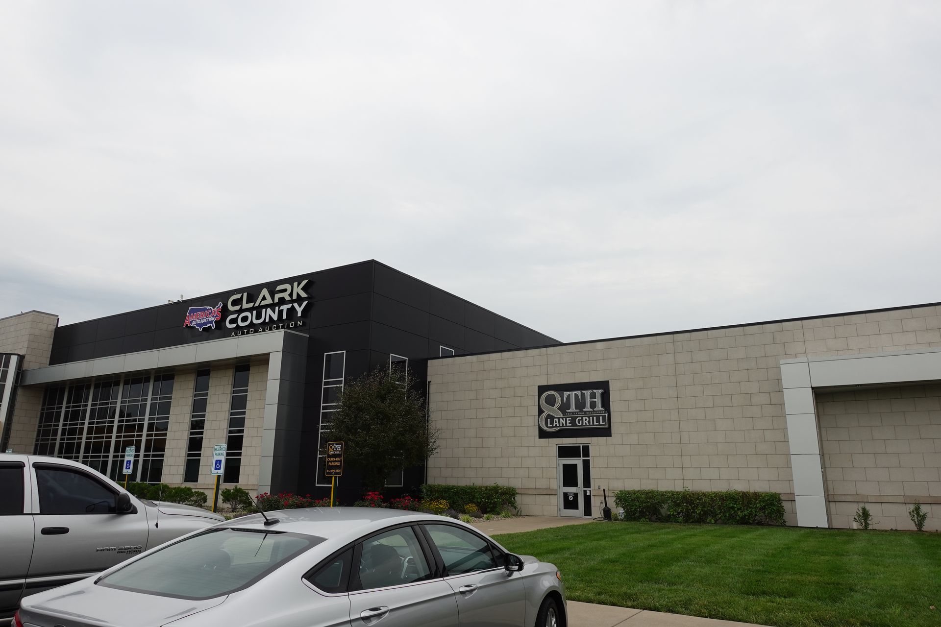 A car is parked in front of a building that says clark county