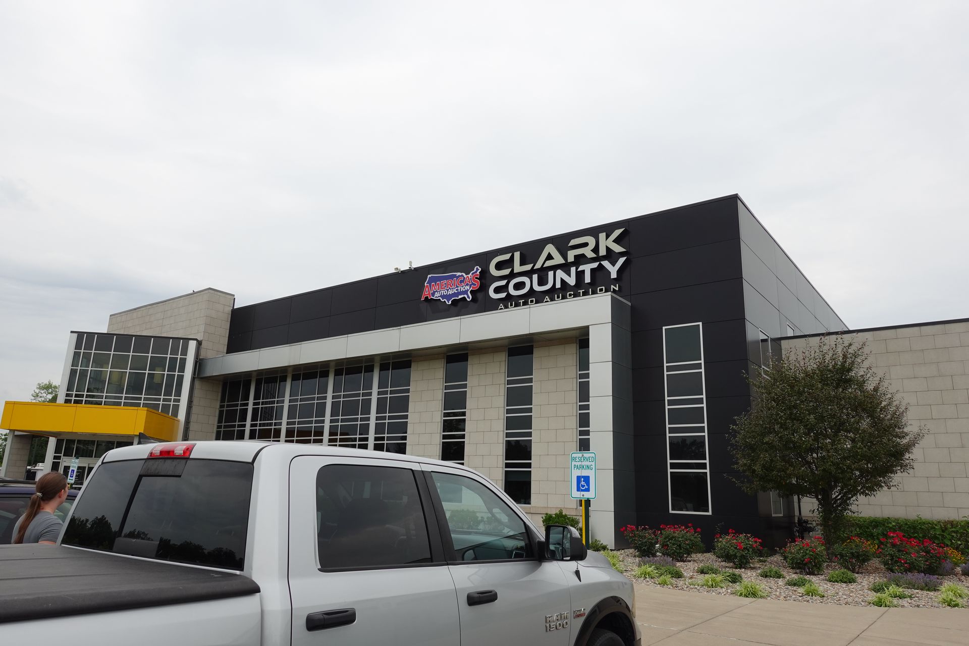 A truck is parked in front of a clark county building.