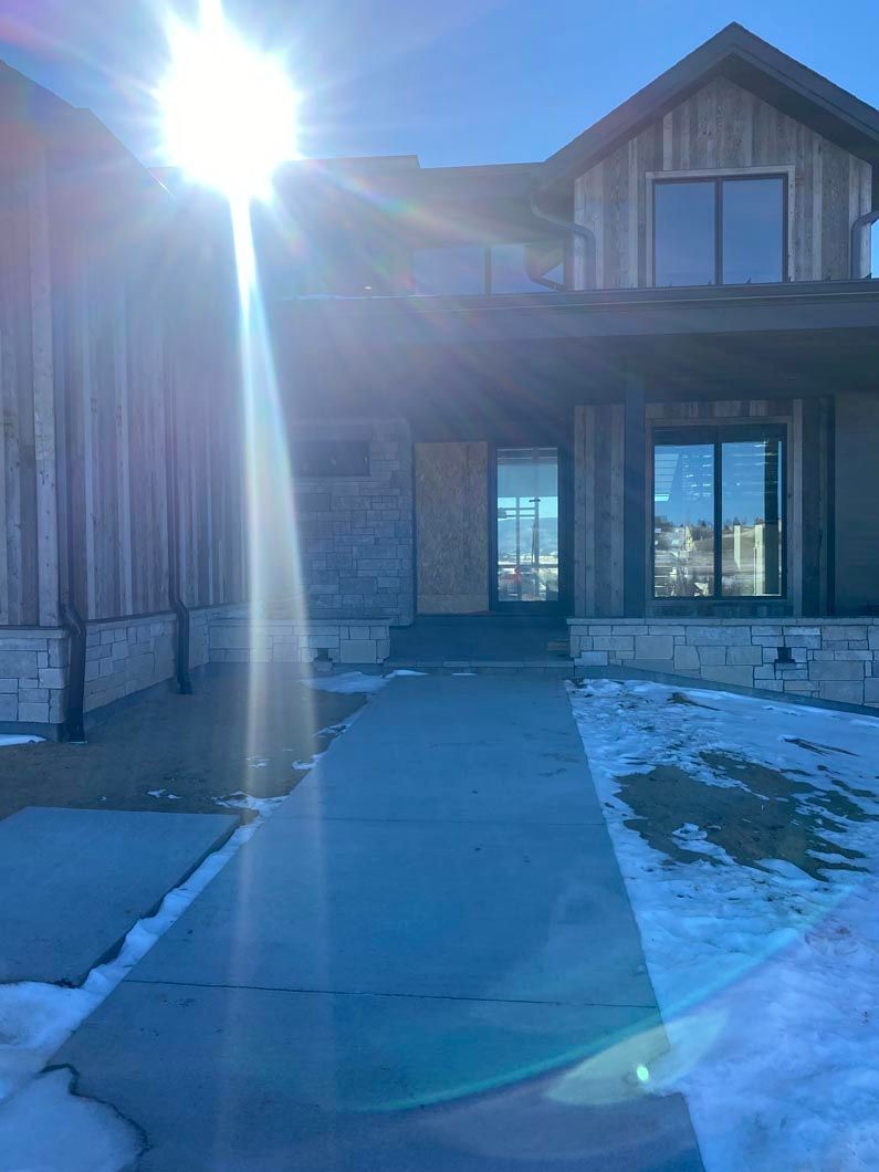 The sun is shining through the windows of a house.