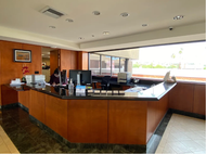 A blue realtor logo on a white background