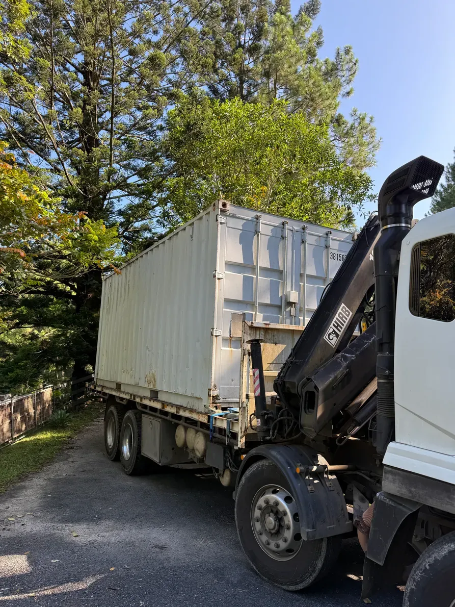 A Truck is Loading Boxes on a Pallet in a Warehouse — Brodees Crane Trucks in Murwillumbah, NSW