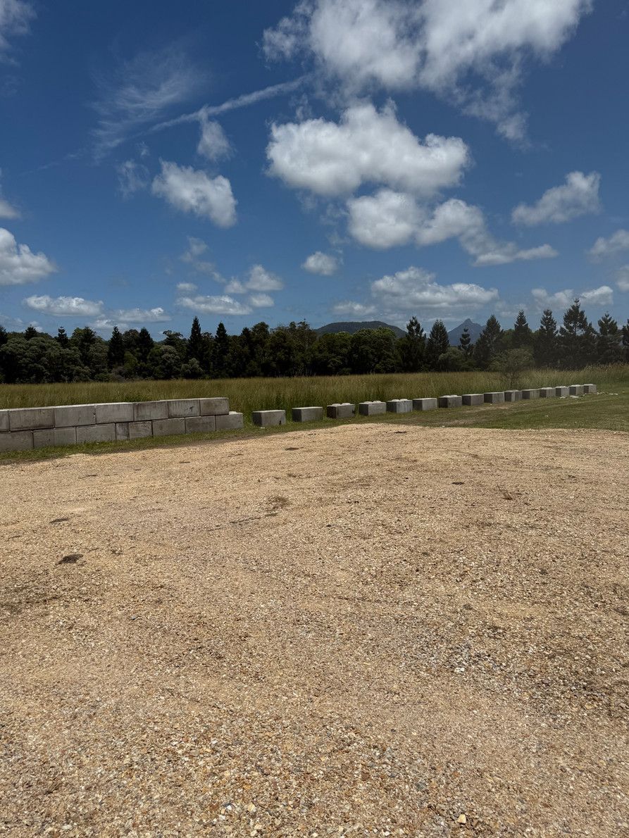 Concrete Blocks Are Laid Through a Yard— Brodees Crane Trucks in Murwillumbah, NSW