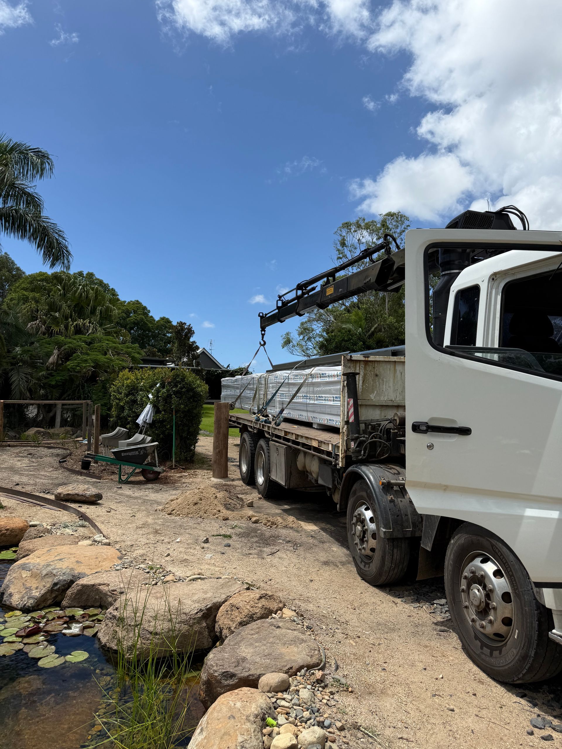 A Crane Truck is Moving Ply — Brodees Crane Trucks in Northern, NSW
