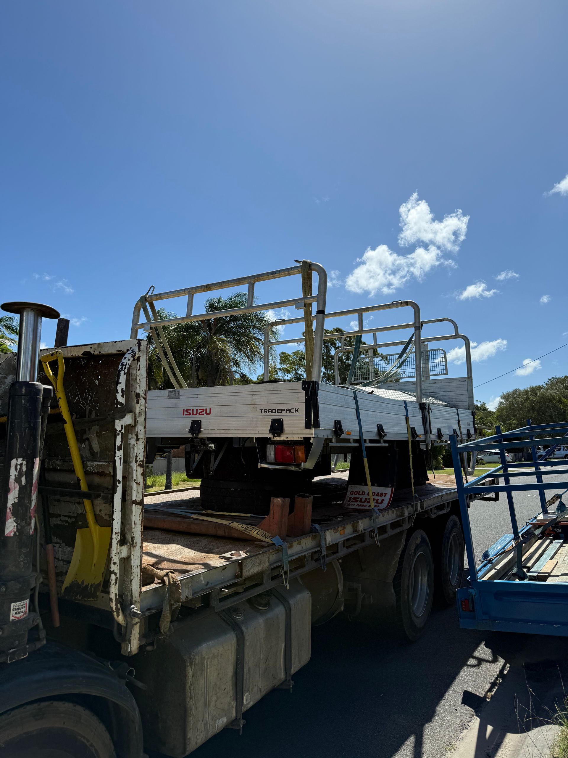 A Truck Carrying a Trailer — Brodees Crane Trucks in Byron Bay, NSW