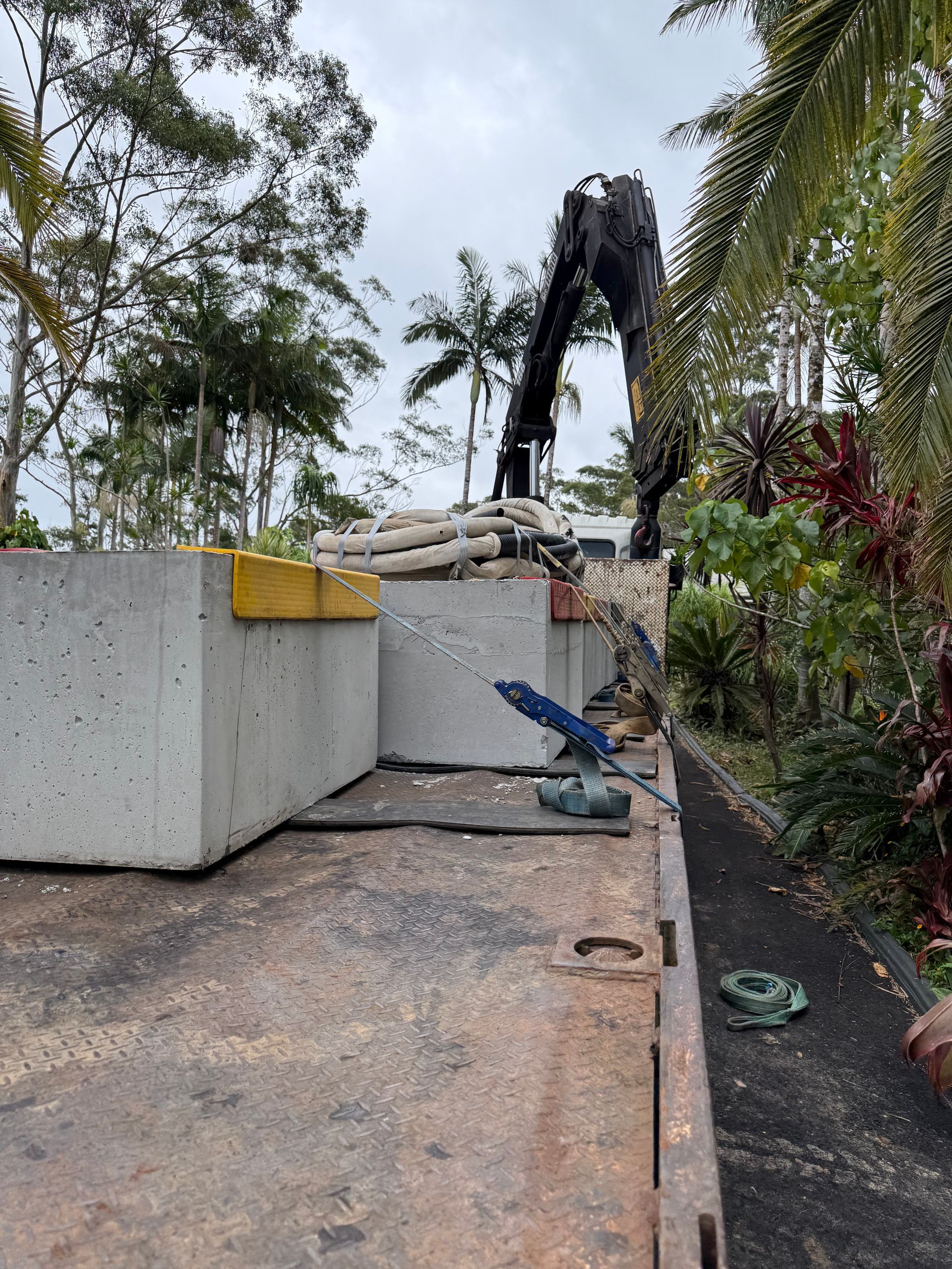 Concrete Blocks Are Strapped Down on a Truck — Brodees Crane Trucks in Casino, NSW