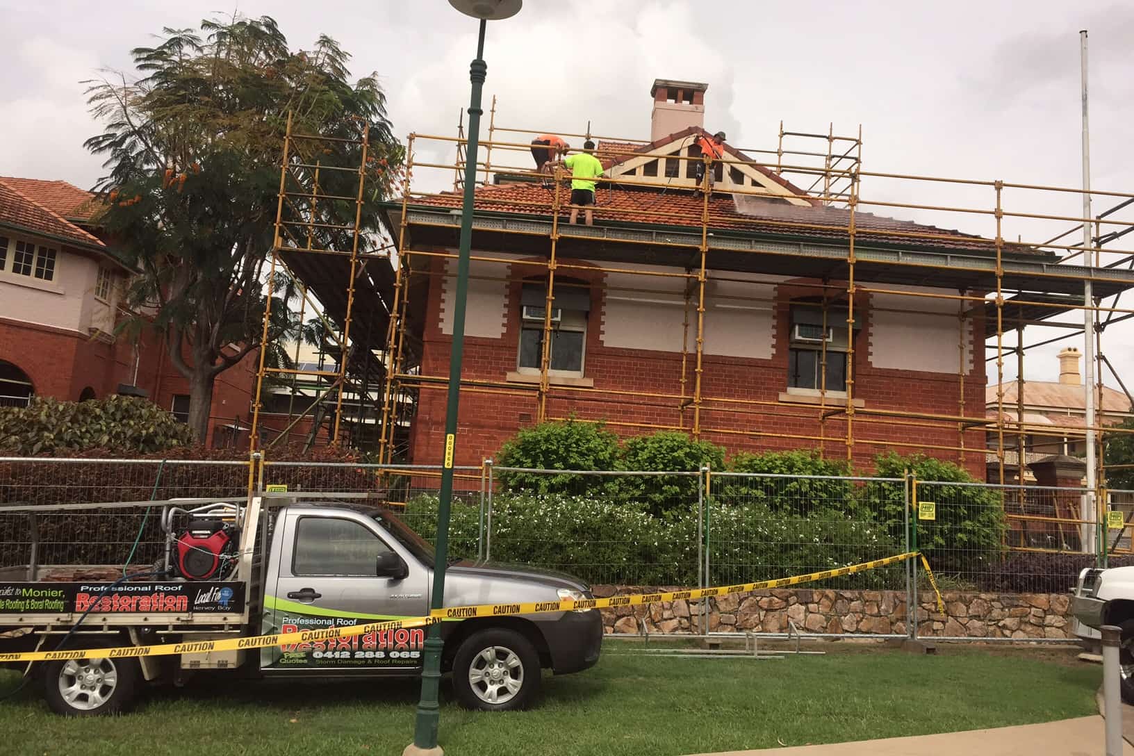 A Truck is Parked in Front of a Brick Building Under Construction — Roofpoint In Kawungan, QLD