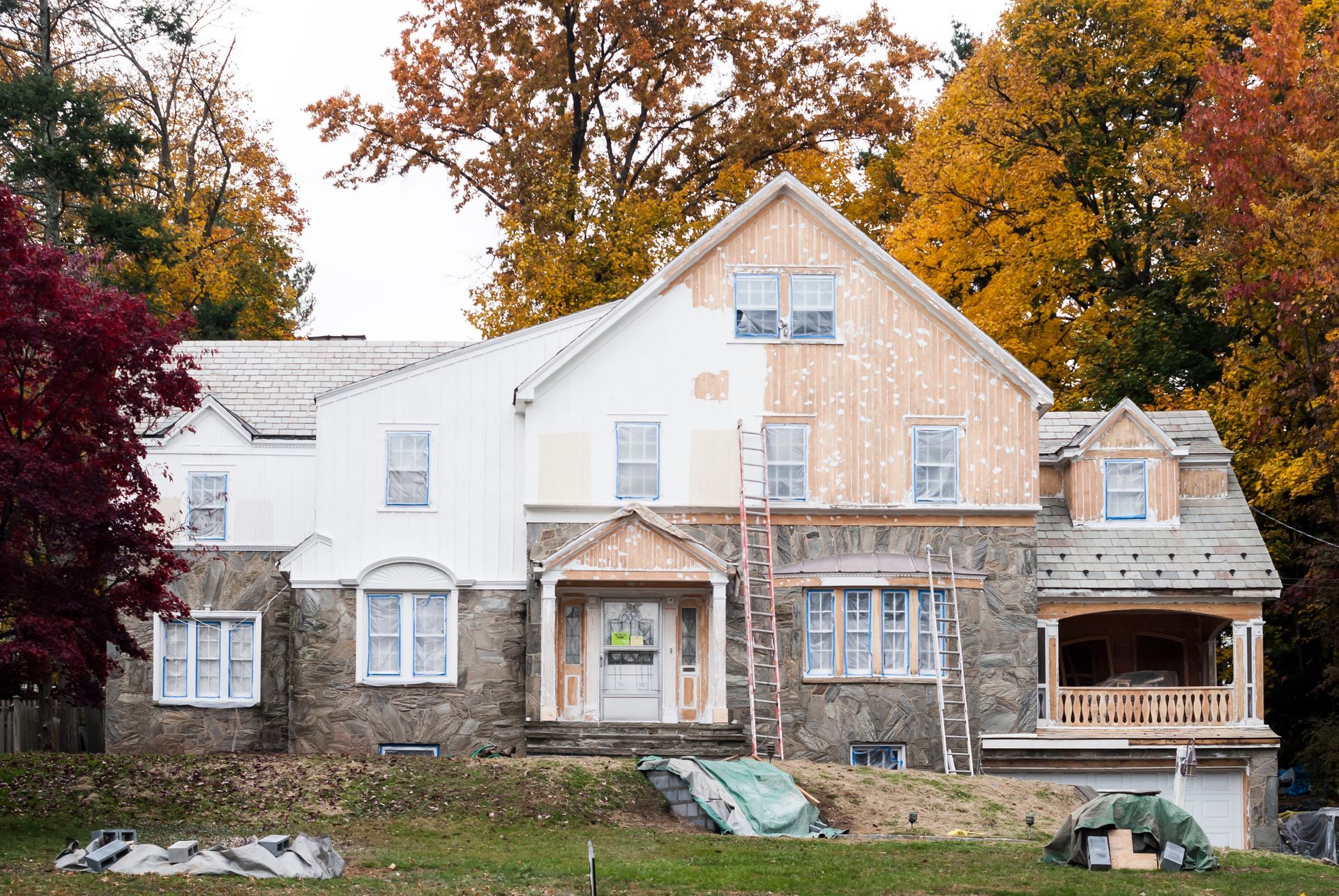 The exterior of a house being painted. The exterior of a house being painted.