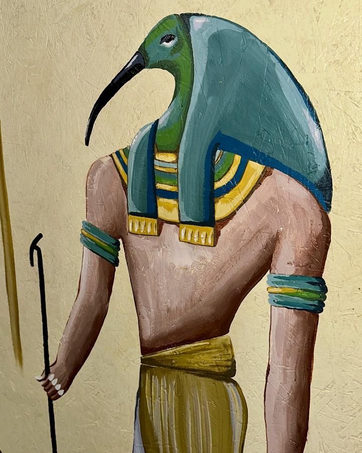 Egyptian god Thoth with ibis head, turquoise and gold details, holding staff, against gold background.